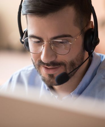 Team member on headset answering nbn calls for the Canberra region