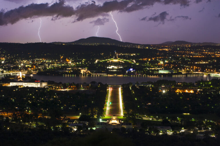 Stormy Canberra from Mount Ainslie - Credit: Martin Ollman